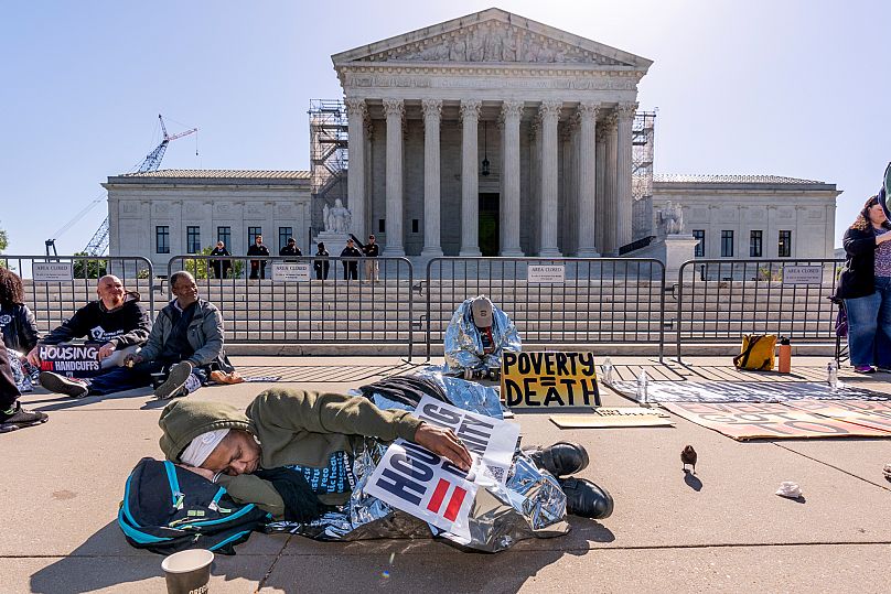 Activists demonstrate at the Supreme Court as the justices consider a challenge to rulings about punishing homeless people, 22 April, 2024