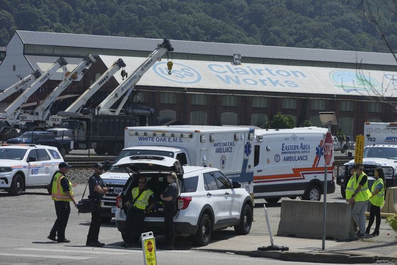 Emergency crew gather after an explosion at the Clairton Coke Works, a U.S. Steel coking plant, Monday, Aug 11, 2025, in Clairton, Penn. (AP Photo/Gene Puskar)