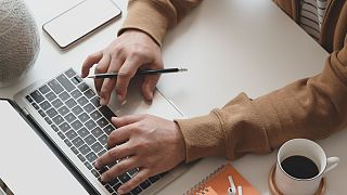 Person drafting email.