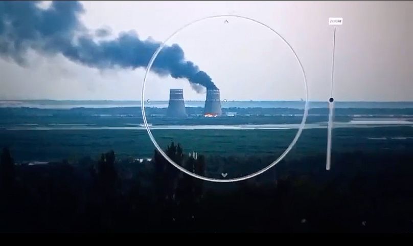 Smoke rises from a cooling tower of the Zaporizhzhia Nuclear Power Station in a Russia-controlled area of Ukraine, 11 August, 2024