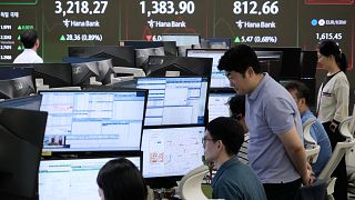 Currency traders watch monitors at the foreign exchange dealing room of the Hana Bank headquarters in Seoul, South Korea.