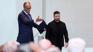 -Germany's Chancellor Friedrich Merz, left, and Ukraine's President Volodymyr Zelenskyy arrive for a news conference at the chancellery in Berlin, Germany, May 28, 2025.