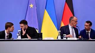 Ukrainian President Volodymyr Zelenskyy and German Chancellor Friedrich Merz attend a video meeting of European leaders with US President Donald Trump in Berlin, 13 August 202