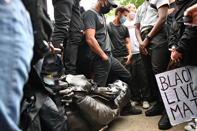Protesters topple a statue of slave trader Edward Colston in Bristol, England, on 7 June 2020, during a Black Lives Matter rally sparked by George Floyd’s killing.