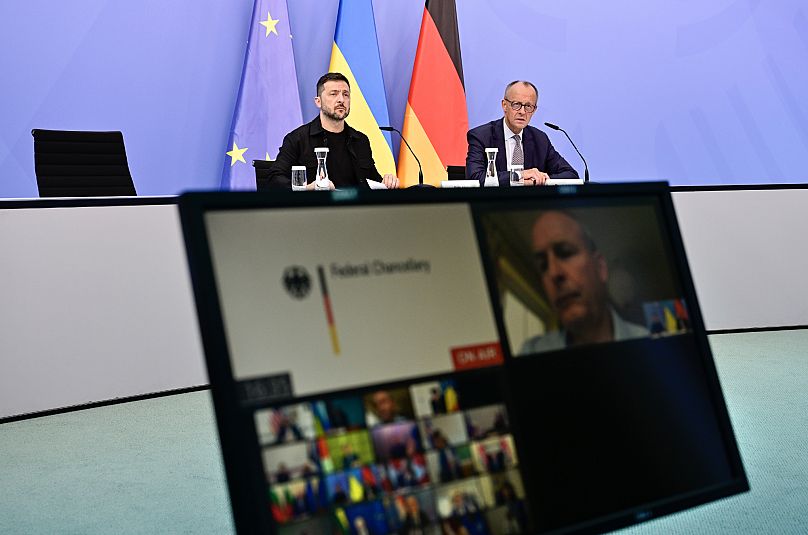 Ukrainian President Volodymyr Zelenskyy, left, and German Chancellor Friedrich Merz attend a video meeting of European leaders in Berlin, 13 August, 2025