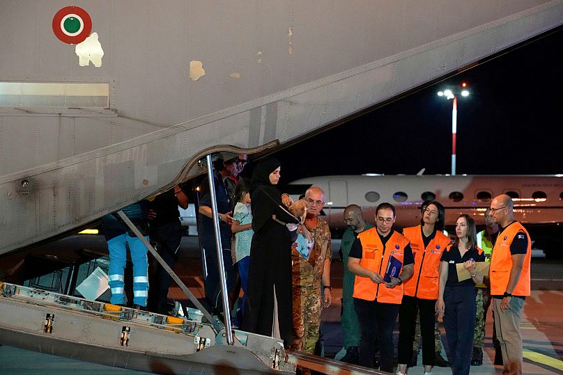 Palestinian children and their families evacuated from Gaza arrive at Rome's Ciampino military airport, 14 August, 2025