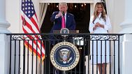 President Donald Trump speaks as first lady Melania Trump listens at a picnic for military families at the White House on 4 July, 2025.