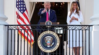 President Donald Trump speaks as first lady Melania Trump listens at a picnic for military families at the White House on 4 July, 2025.