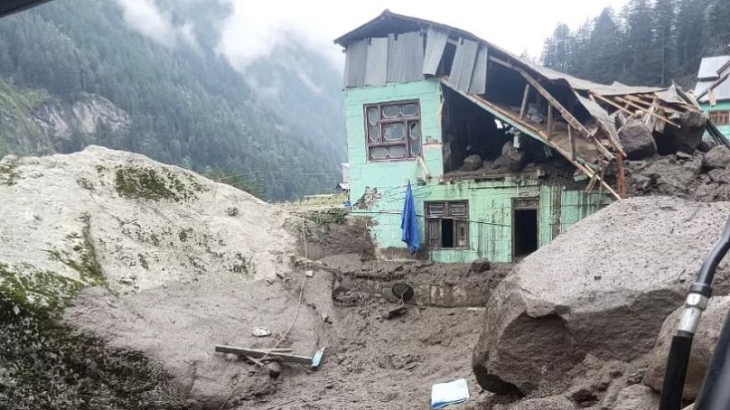 A building damaged in flash floods caused by torrential rains are seen in a remote village in Chositi, 14 August, 2025