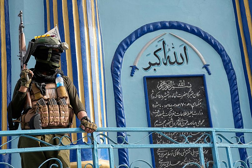 A Taliban fighter stands guard next to the Shah-Do Shamshira Mosque in Kabul, 7 June, 2025