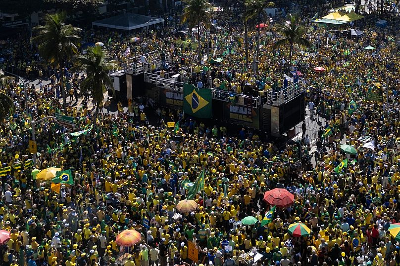 People take part in a demonstration to protest former President Jair Bolsonaro's Supreme Court trial, 3 August, 2025