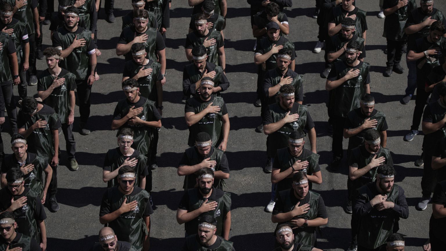 FILE: Hezbollah supporters beat their chests as they march in Beirut, 6 July 2025