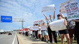 Air Canada flight attendants strike outside Montreal–Trudeau International Airport in Montreal, Saturday, Aug. 16, 2025.