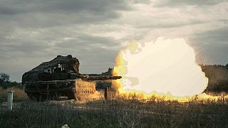 A Russian tank fires during a practice at a training ground during on an undisclosed location in Ukraine, Russian Defence Ministry, Friday, Aug. 15, 2025