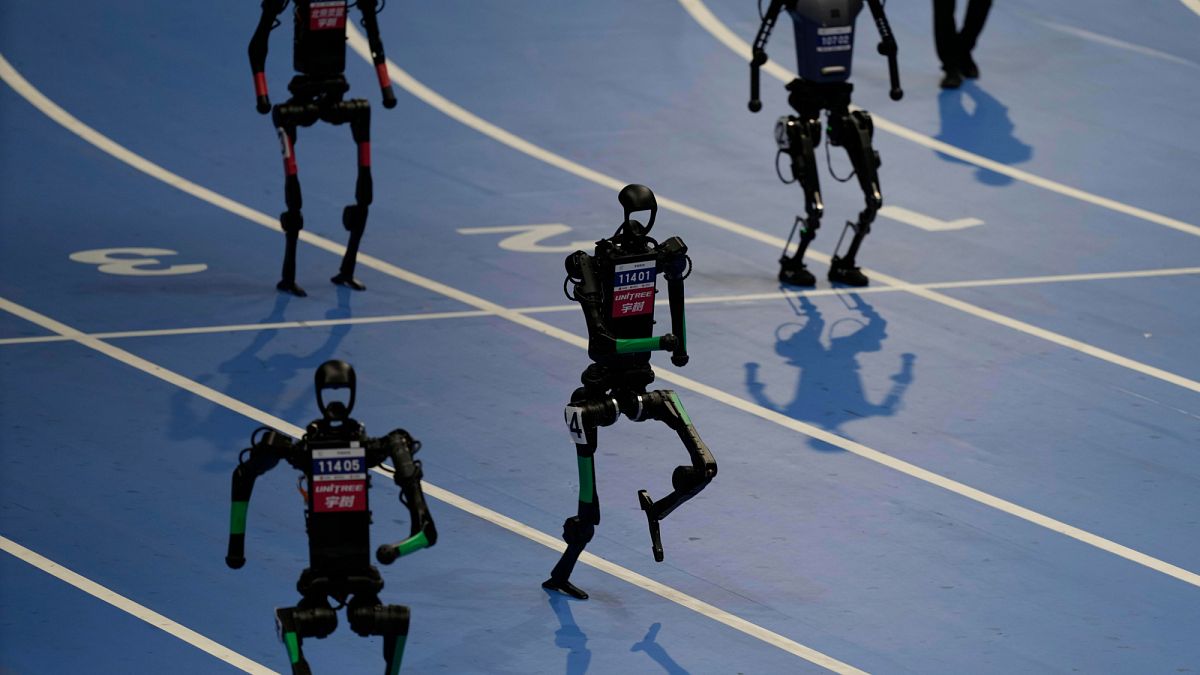 WATCH: Robots sprint and play football at first world games in Beijing