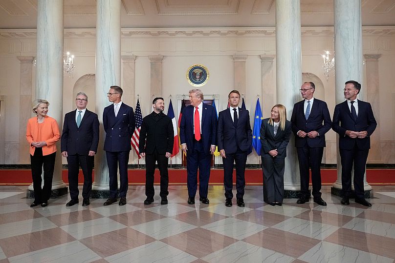 US President Donald Trump, Ukrainian President Volodymyr Zelenskyy and European allies stand before a group photo at the White House, Monday, Aug. 18, 2025, in Washington.