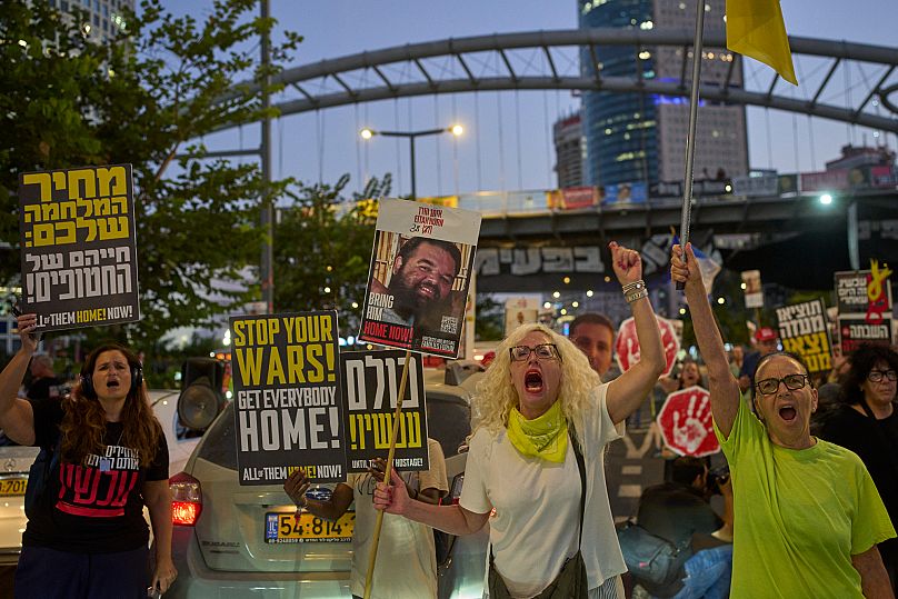 Supporters of Israeli hostages held in Gaza attend a rally demanding their release from Hamas captivity and calling for an end to the war, in Tel Aviv, Israel, Aug. 19, 2025.