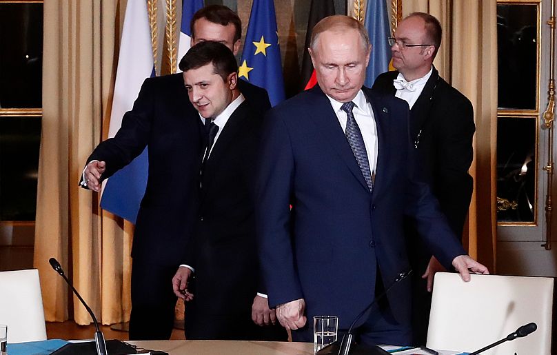 Russian President Vladimir Putin and Ukrainian President Volodymyr Zelenskyy arrive for a working session in Paris, 9 December, 2019