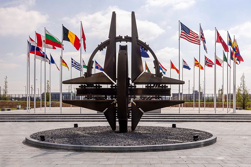 Flags of NATO members outside the alliance’s headquarters in Brussels, 10 April, 2025