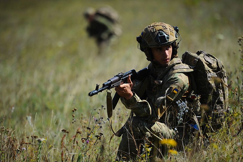 Soldiers aged 18 to 24 practice military skills on a training ground near Kharkiv, 19 August, 2025