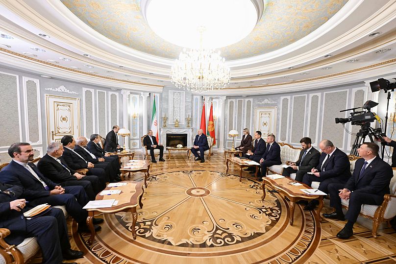 The presidents of Belarus and Iran talk to each other during their meeting in Minsk, 20 August, 2025