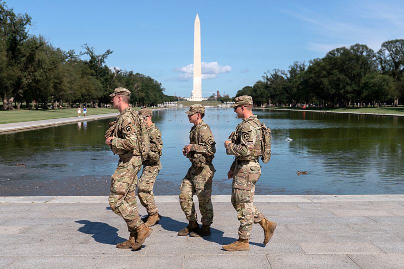 Members of the West Virginia National Guard patrol the National Mall Saturday, Aug. 23, 2025, in Washington.