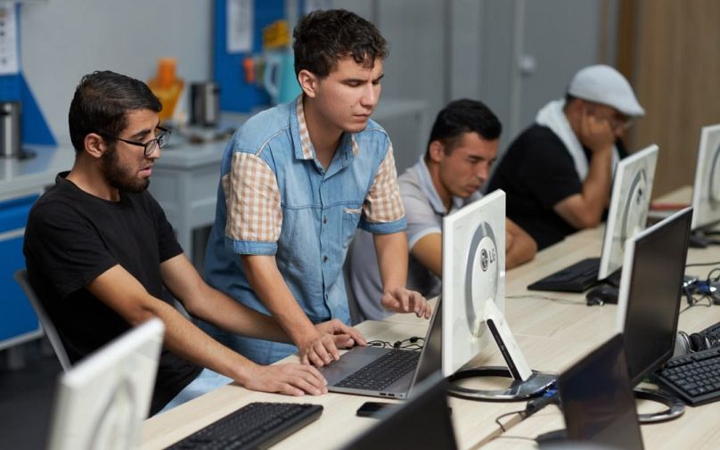 Young learners gaining practical experience in computer graphics at the vocational training center.