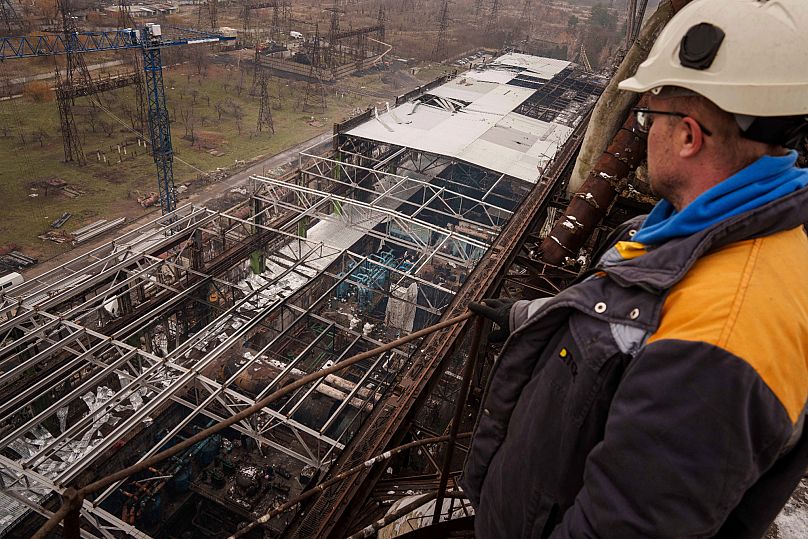 A worker looks on a production hall after a recent Russian missile attack at DTEK's power plant in Ukraine, 28 November, 2024