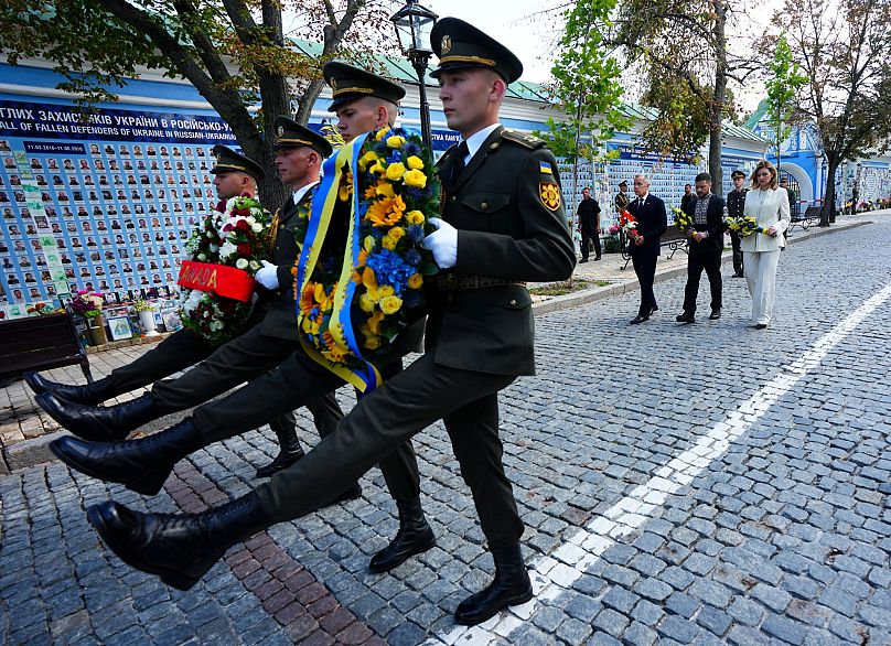 Canada's Prime Minister Mark Carney joins Ukrainian President Volodymyr Zelenskyy and his wife, Olena Zelenska, at a wreath laying ceremony in Kyiv, 24 August, 2025