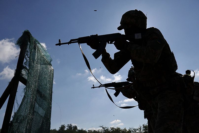 Recruits practice military skills on a training ground in a sunflower field in the Zaporizhzhia region, 25 August, 2025