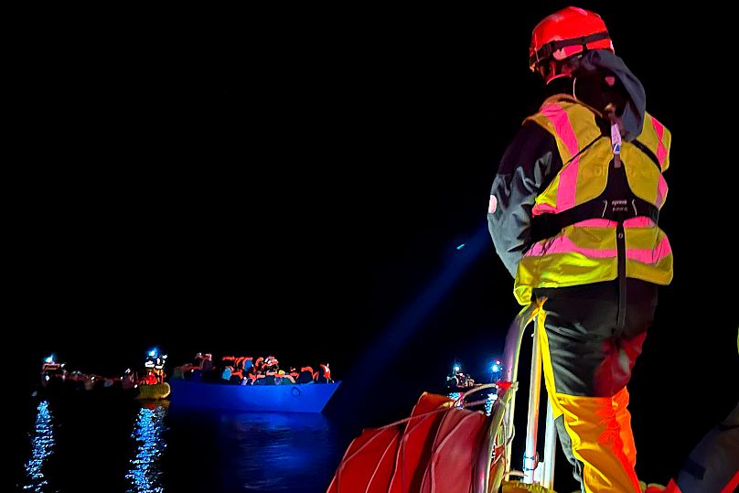 Rescue personnel of the Ocean Viking attend migrants rescued from a wooden boat in the Mediterranean Sea, 14 March, 2024