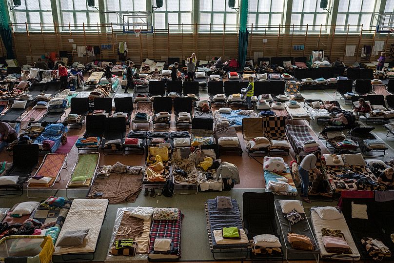 Refugees who fled the war in Ukraine rest at a centre at the Medyka border crossing, 15 March, 2022