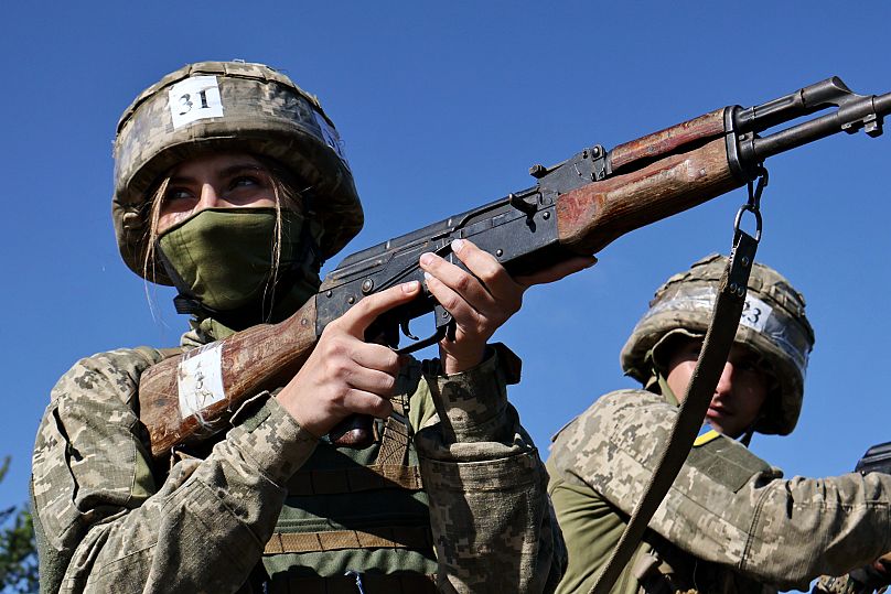 Recruits practice military skills on a training ground in a sunflower field in the Zaporizhzhia region, 25 August, 2025