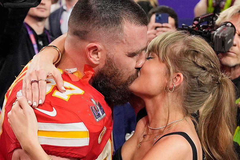 Kansas City Chiefs tight end Travis Kelce and Taylor Swift kiss after the Chiefs defeated the San Francisco 49ers in the NFL Super Bowl 58 football game, 11 February, 2024