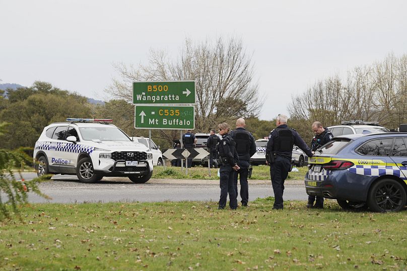 Police wait near the scene of a shooting in the high country of Porepunkah in the state of Victoria, Australia, Tuesday, Aug. 26, 2025