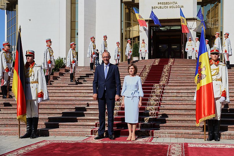 German Chancellor Friedrich Merz poses with Moldova's President Maia Sandu during a welcoming ceremony in Chişinău, 27 August, 2025