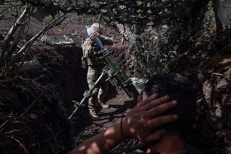 Soldiers fire a mortar towards positions of Russian troops near Kostyantynivka in the Donetsk region, 26 August, 2025