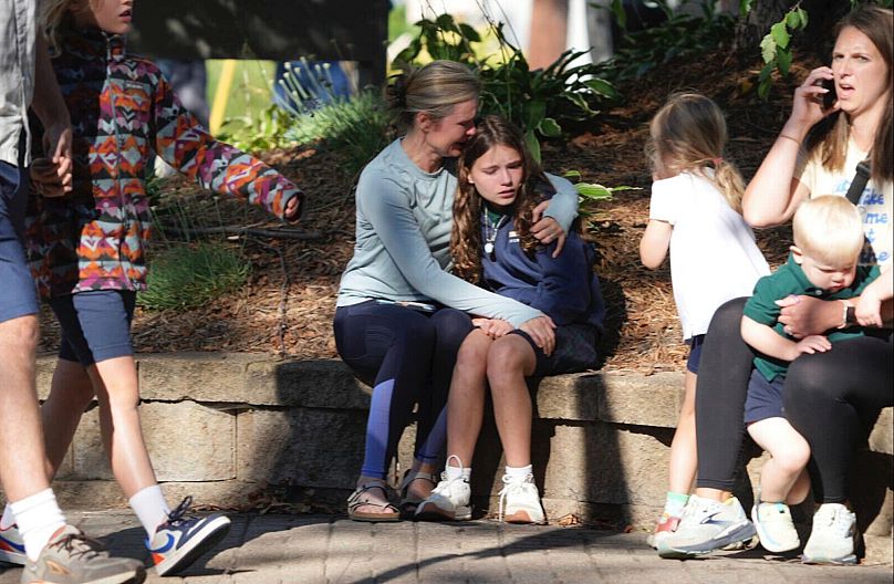 Parents await news of their children after a reported mass shooting at Annunciation Church in Minneapolis, 27 August, 2025