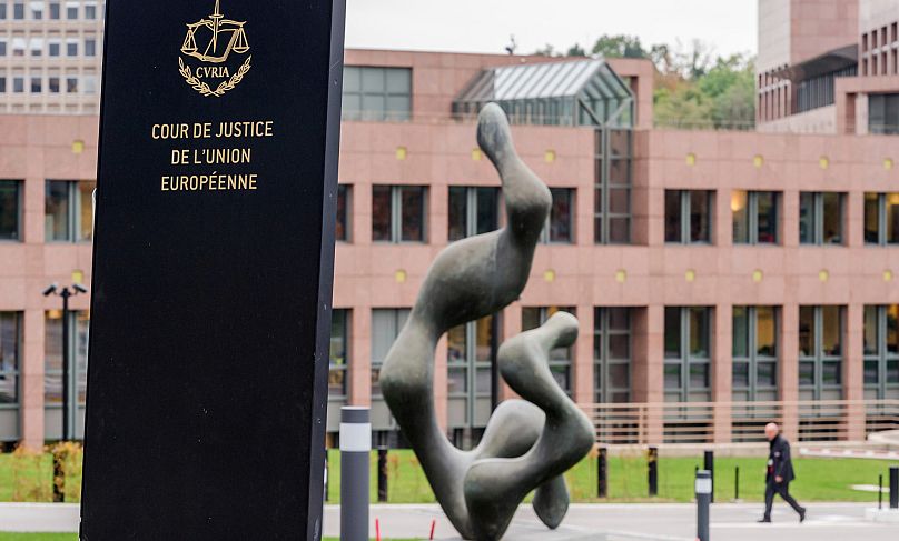 A man walks by the European Court of Justice in Luxembourg, 5 October, 2015