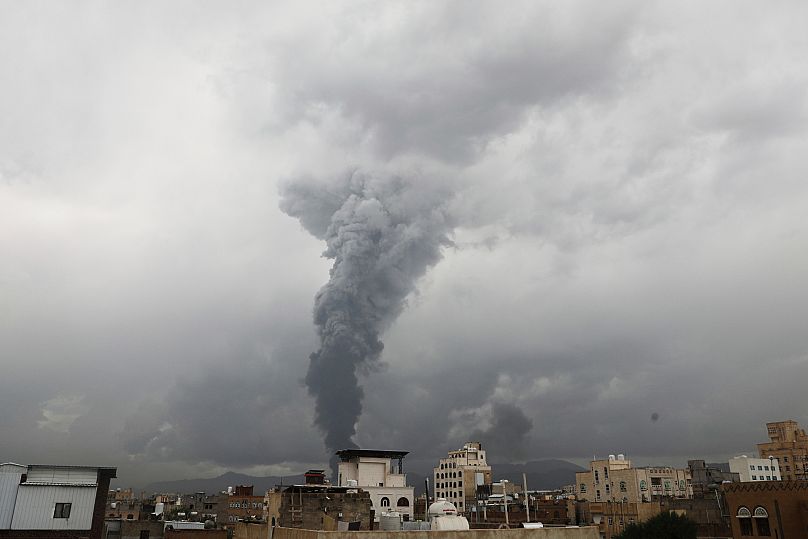 Smoke billows following Israeli air strikes in multiple areas in Sanaa, 24 August, 2025