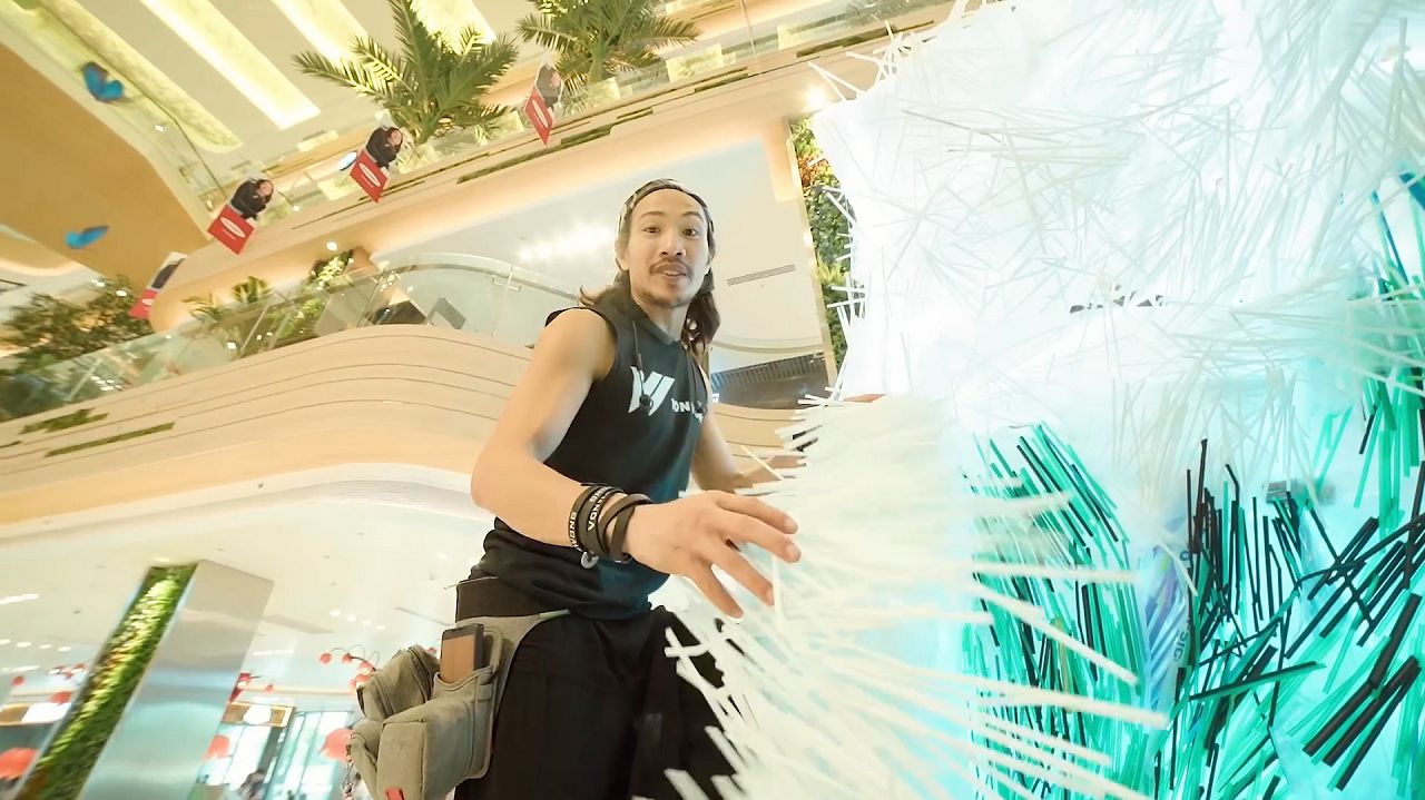 The artist at work on the installation "Strawpocalypse"