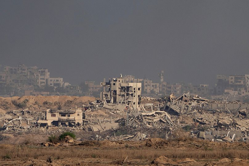 Buildings that were destroyed during the Israeli ground and air operations stand in the Gaza Strip as seen from southern Israel, 28 August, 2025
