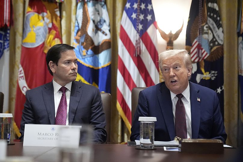 US President Donald Trump speaks during a cabinet meeting in Washington while Secretary of State Marco Rubio looks on, 26 August, 2025