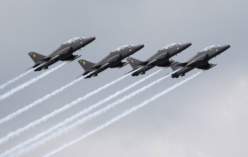 FILE - Finnish aerobatics group Midnight Hawks performs during a celebration marking the Russian air force's 100th anniversary in Zhukovsky, Moscow, Russia, on Aug. 11, 2012