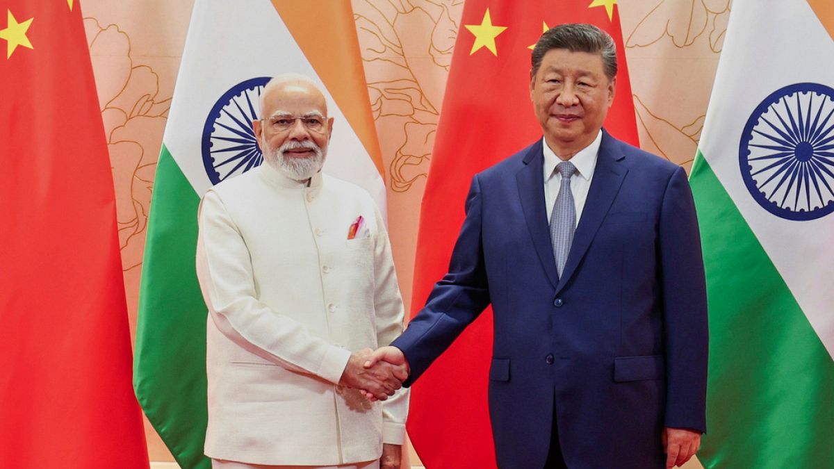 China’s Xi and India’s Modi vow stronger ties in landmark meeting ahead regional summit
