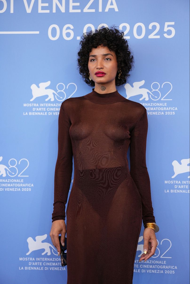 Sheer and see-through in Saint Laurent: Indya Moore at the photo call for 'Father Mother Sister Brother'