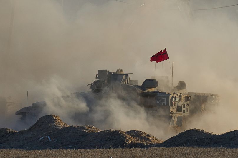 Israeli soldiers move armoured personnel carriers near the Israeli-Gaza border, 2 September, 2025