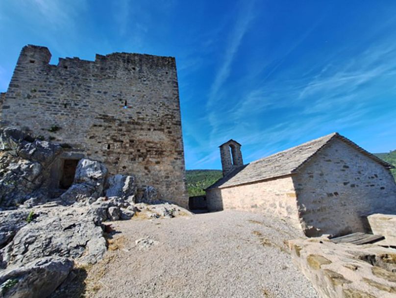 The main building and the restored chapel at Petrapilosa Castle