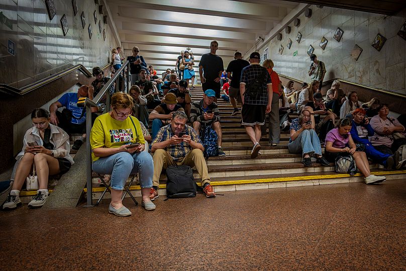 People rest in a metro station being used as a bomb shelter during a Russian attack in Kyiv, 2 September, 2025