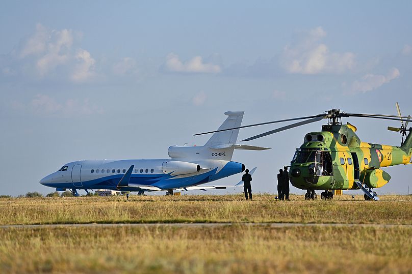 A Romanian military helicopter is parked next to the plane carrying Ursula von der Leyen during her visit at the Mihail Kogalniceanu Air Base, 1 September, 2025
